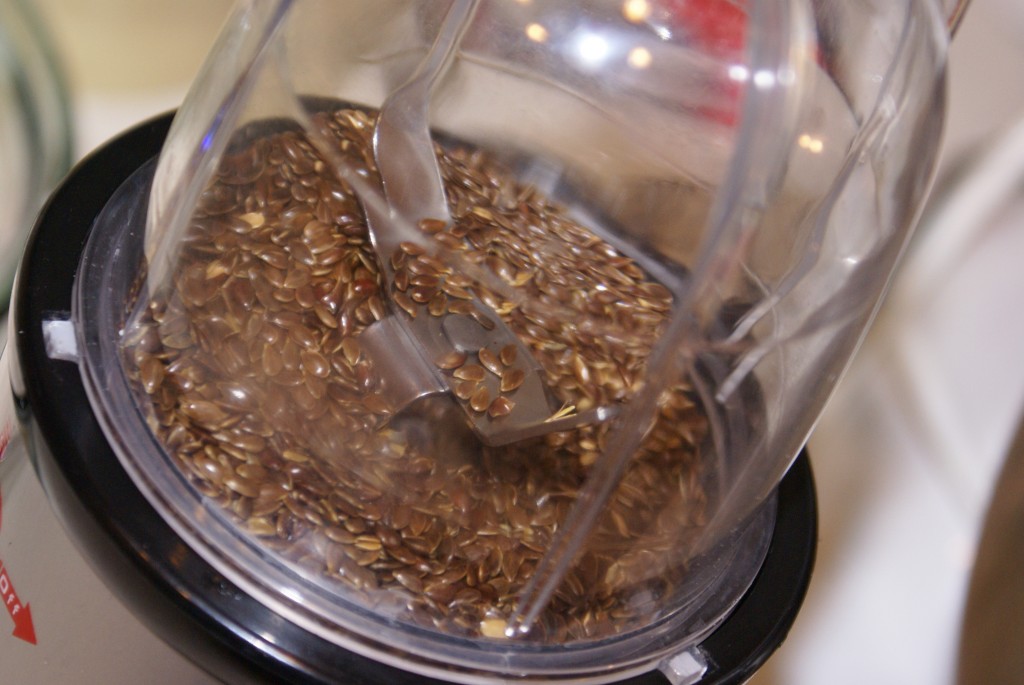 Flax seeds in food processor Flax seeds about to get ground into flax meal.
