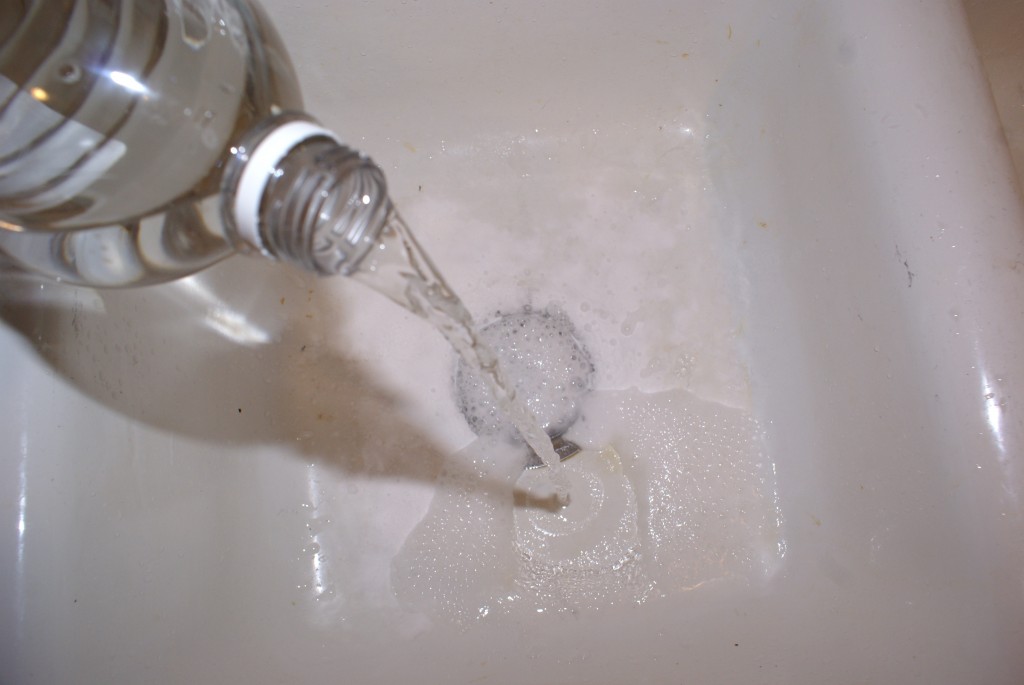 Vinegar and baking soda bubbling in sink Vinegar and baking soda bubbling in sink.