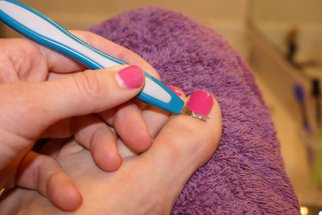 Cuticle knife Cuticle knife on toenail. Notice bare fingernail where gel has grown out.