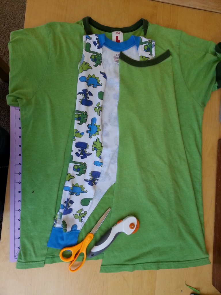 Cut out a piece of an old t-shirt to fill in the cut apart pajamas. Cut out a piece of an old t-shirt to fill in the cut apart pajamas.