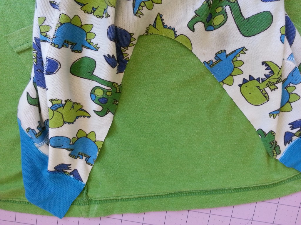 Add t-shirt fabric to fill in back of pajamas. Add t-shirt fabric to fill in back of pajamas.