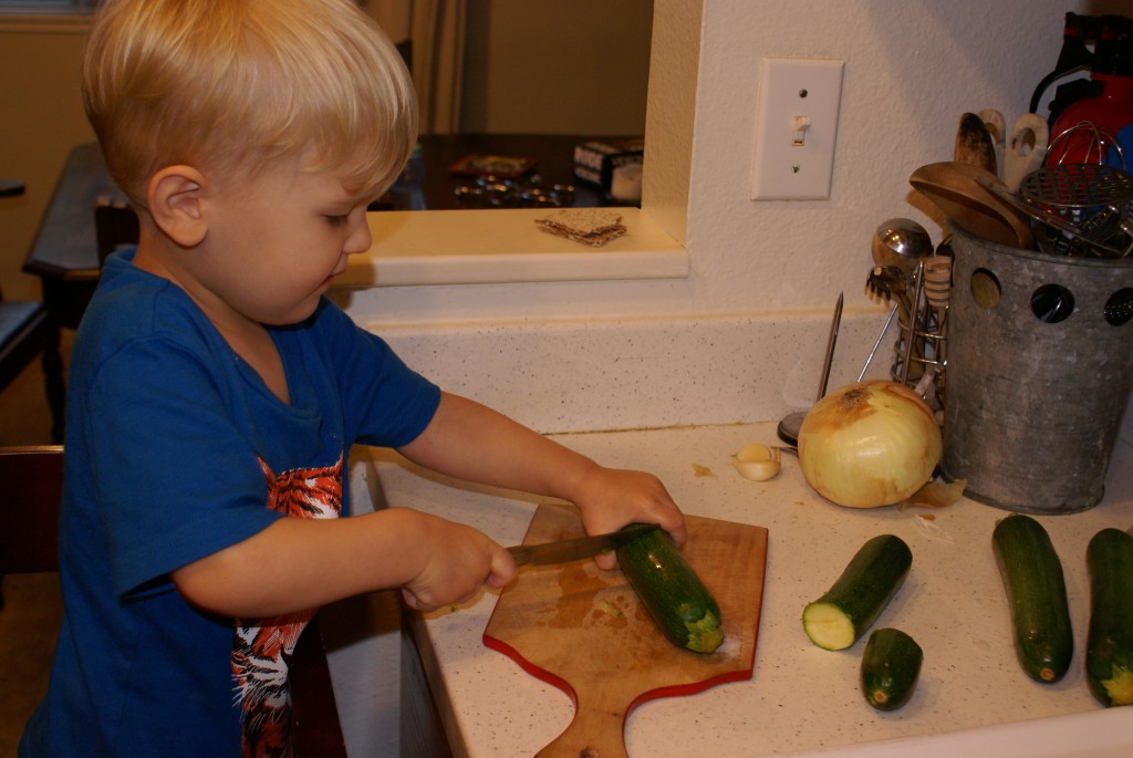 Arlo cuts zucchini Arlo cuts zucchini for pie.