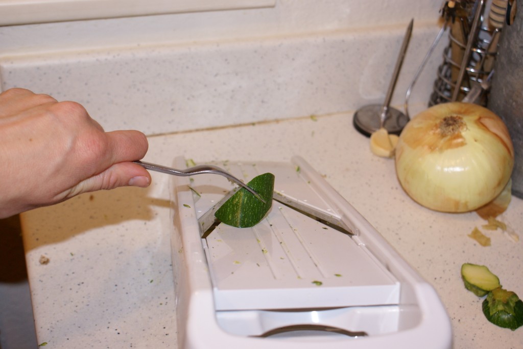 Mandolin slicer with fork to side If you mandolin slicer guide sucks (like mine does), use a fork to keep your hands safe.