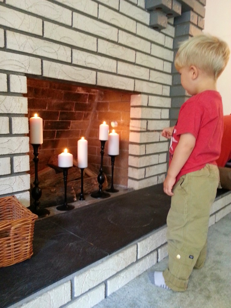 After spending all Summer road tripping and camping, Arlo was very excited to roast marshmallows in our fireplace : ) Notice the water marks and dingy looking slate. It's all brightened up now with just a few coats of clear spray paint!