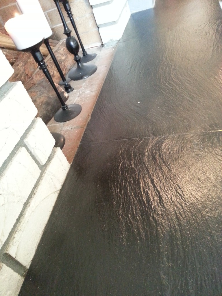 Wet look slate. The only problem is that it shows every little speck of dust.